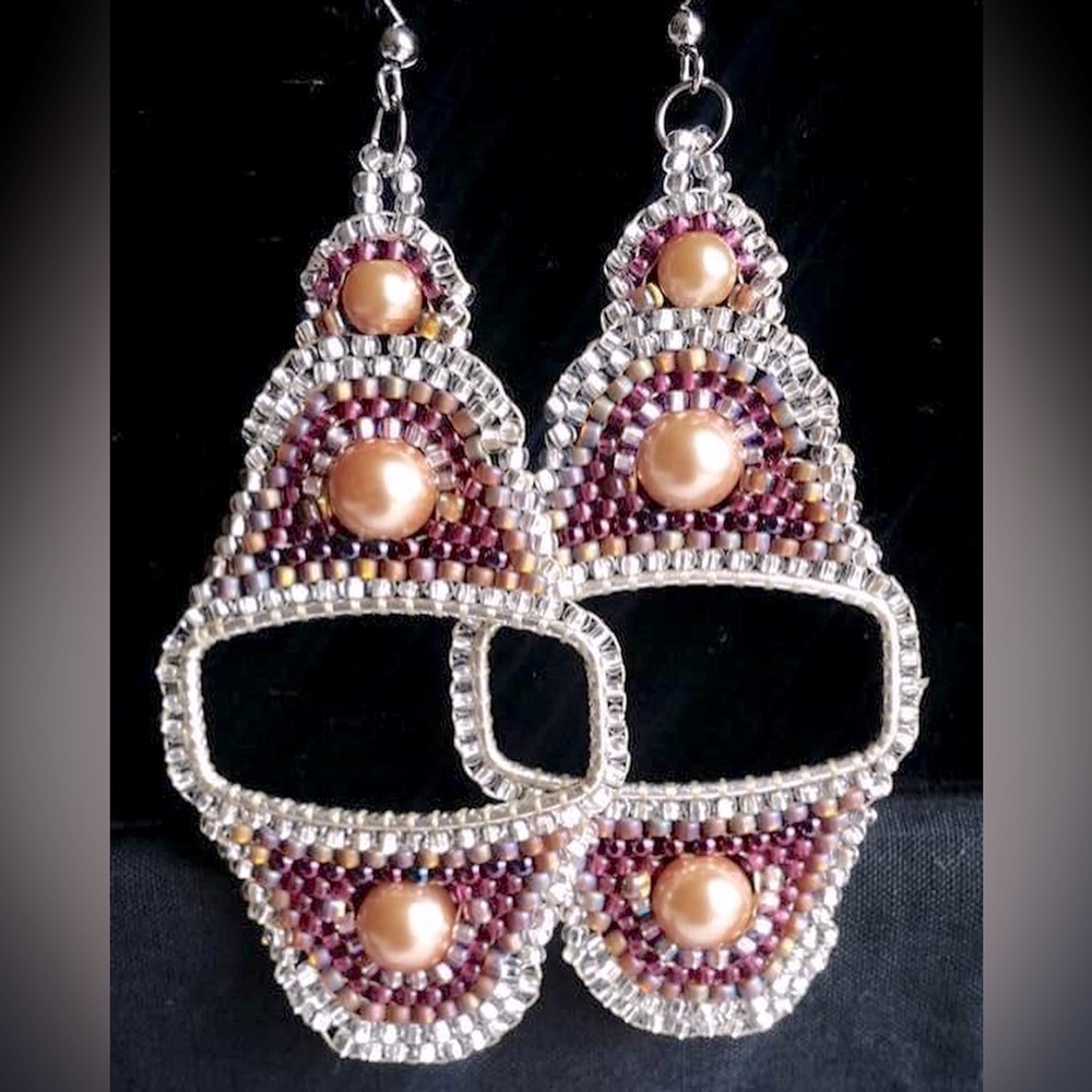 These are handcrafted one of a kind earrings by L. Scott Designs!